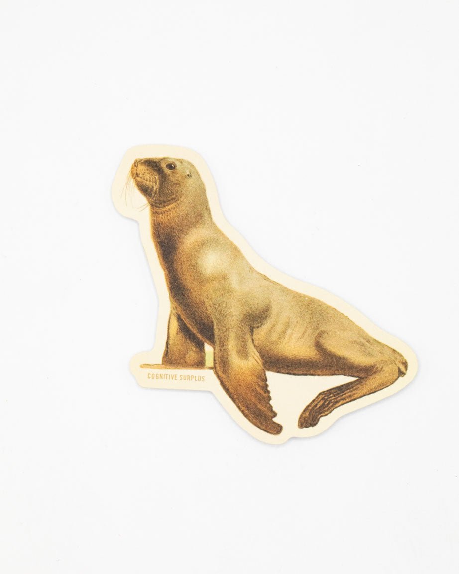 A Cognitive Surplus sea lion sticker on a white background.