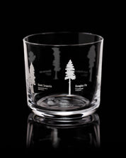 A Forest Giants Whiskey Glass with trees engraved on it by Cognitive Surplus.