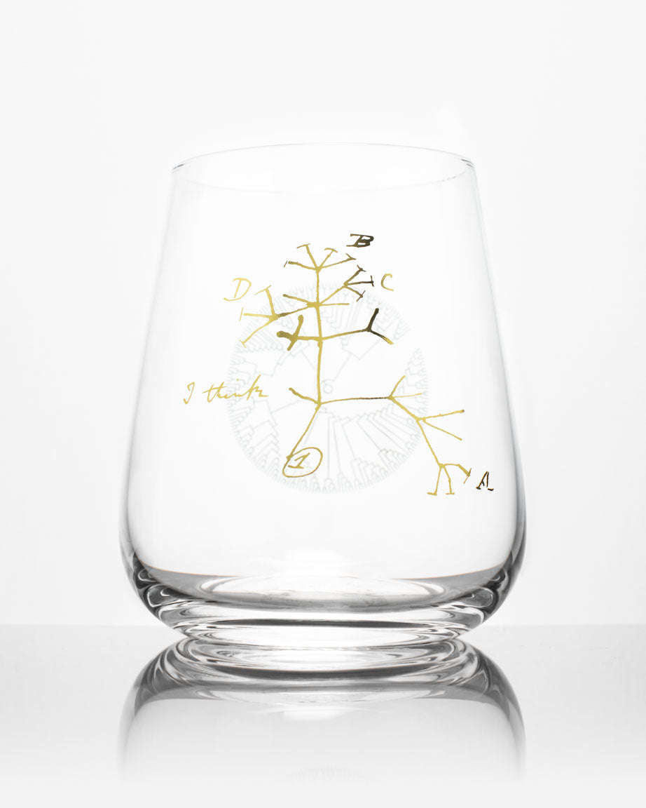 A Tree of Life Wine Glass with a gold tree design on it, by Cognitive Surplus.