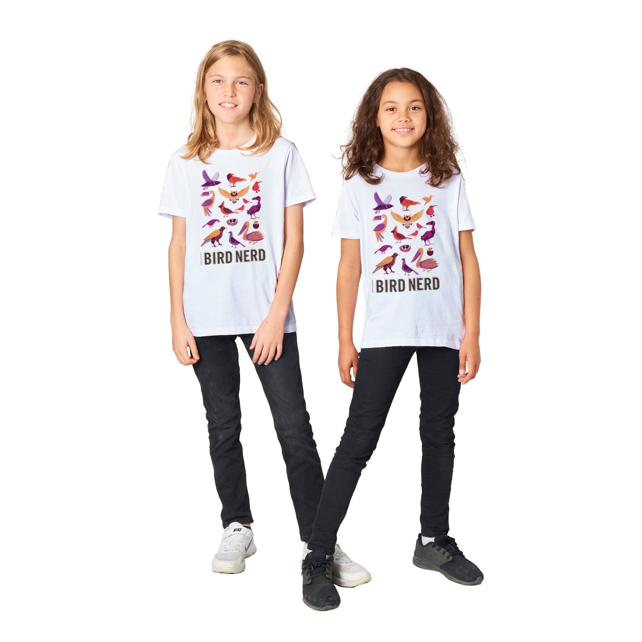 Two children wearing &quot;Bird Nerd&quot; T-shirts with colorful bird illustrations, standing on a white background.