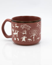 A Cave Paintings Hand Carved 15 oz Ceramic Mug with animals on it. (Brand Name: Cognitive Surplus)