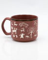 A Cave Paintings Hand Carved 15 oz Ceramic Mug with animals on it. (Brand Name: Cognitive Surplus)