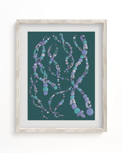 A Cognitive Surplus framed DNA Museum Print with beads on it.