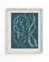 A Cognitive Surplus framed DNA Museum Print with beads on it.