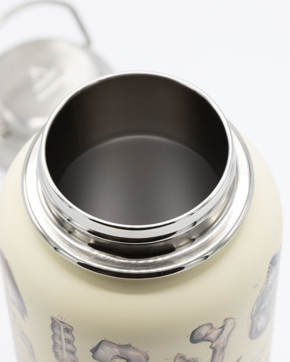 A Skeleton 32 oz Steel Bottle with a lid and a lid, Cognitive Surplus.