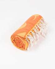 An orange and white Feathered Friends: Ornithology Turkish Towel with fringes.