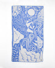 A blue and white Cloud Watching Turkish Towel with a design on it by Cognitive Surplus.