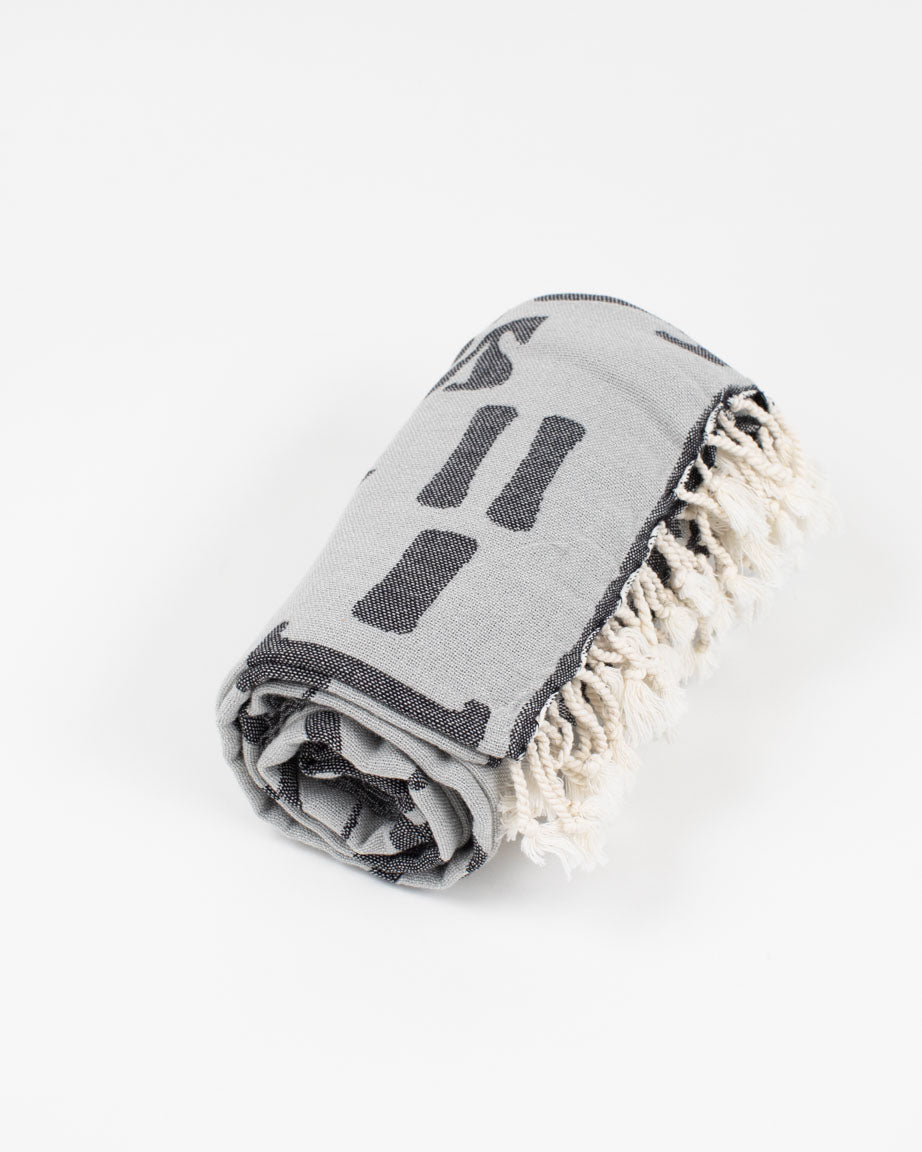 A black and white Equations That Changed the World Turkish Towel by Cognitive Surplus on a white background.