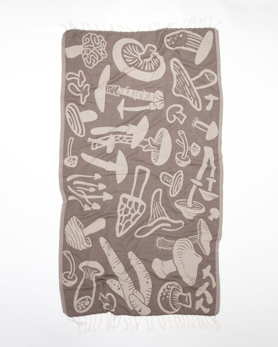 A brown Edible & Poisonous Mushrooms Turkish Towel with a mushroom design on it by Cognitive Surplus.