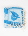A blue and white Ocean Explorer Turkish towel with tassels by Cognitive Surplus.