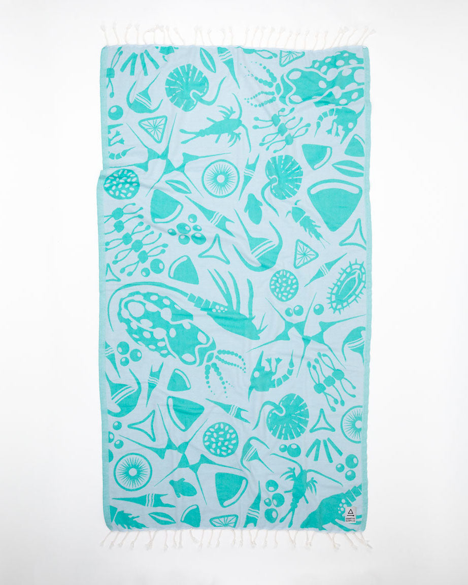 A Go With the Flow: Plankton Turkish Towel by Cognitive Surplus on a white background.