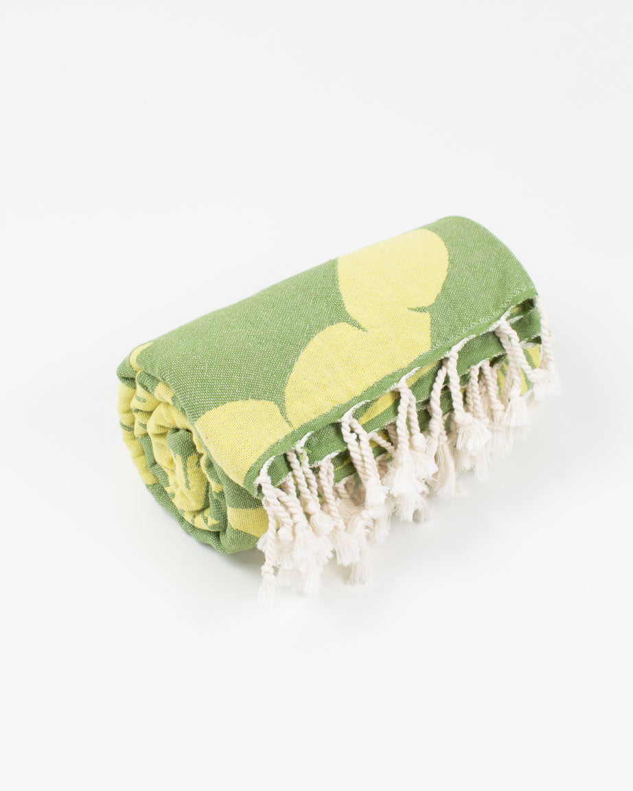 A Seaweed Turkish Towel with tassels by Cognitive Surplus.