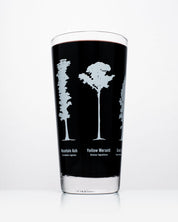 A Forest Giants Beer Glass (12 oz) with a black liquid. - Cognitive Surplus