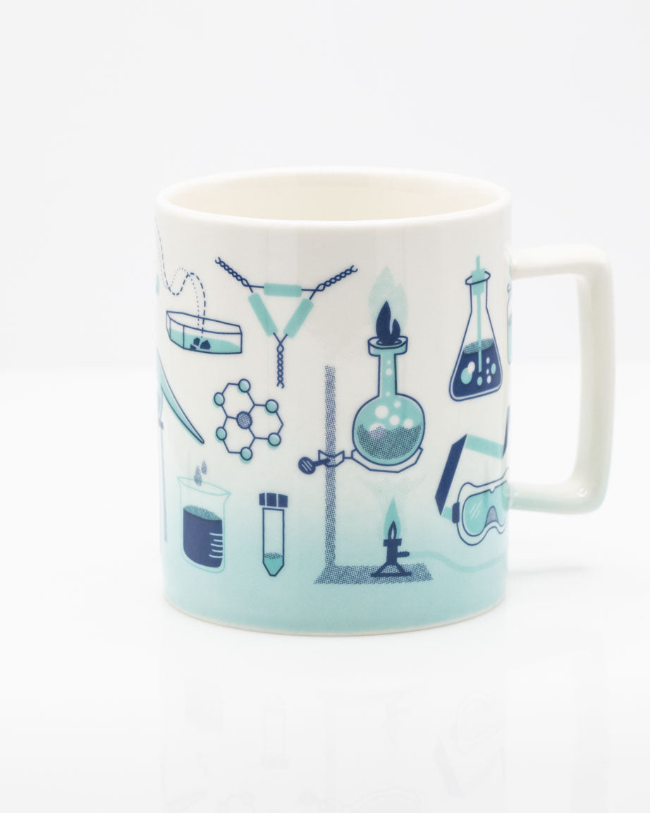 A Retro Laboratory 11 oz Ceramic Mug with illustrations of science equipment.