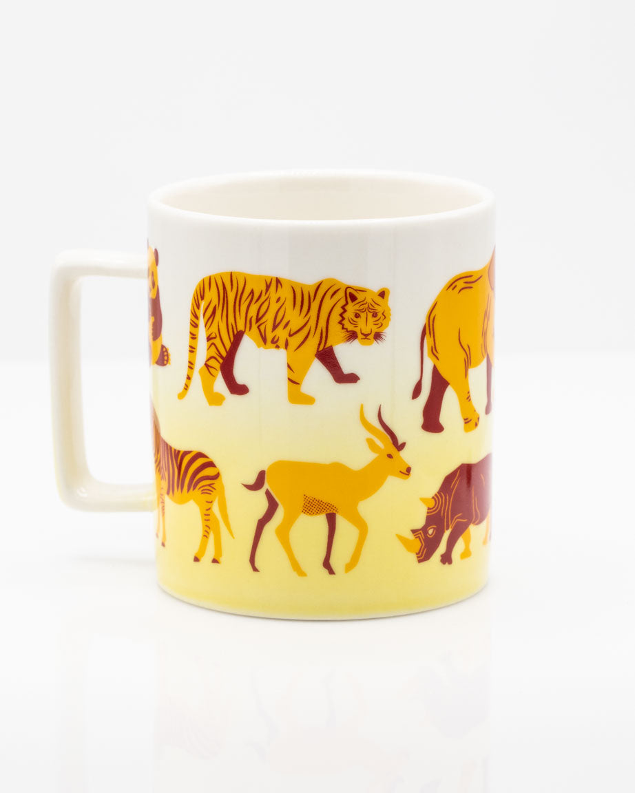A Retro Mammals 11 oz Ceramic Mug with a variety of animals on it. Brand: Cognitive Surplus