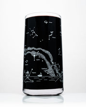 A Classic Science Drinking Glassware Set of 12 with a black liquid from Cognitive Surplus.