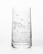 An Above the Earth Drinking Glass with a drawing of a boat on it, made by Cognitive Surplus.