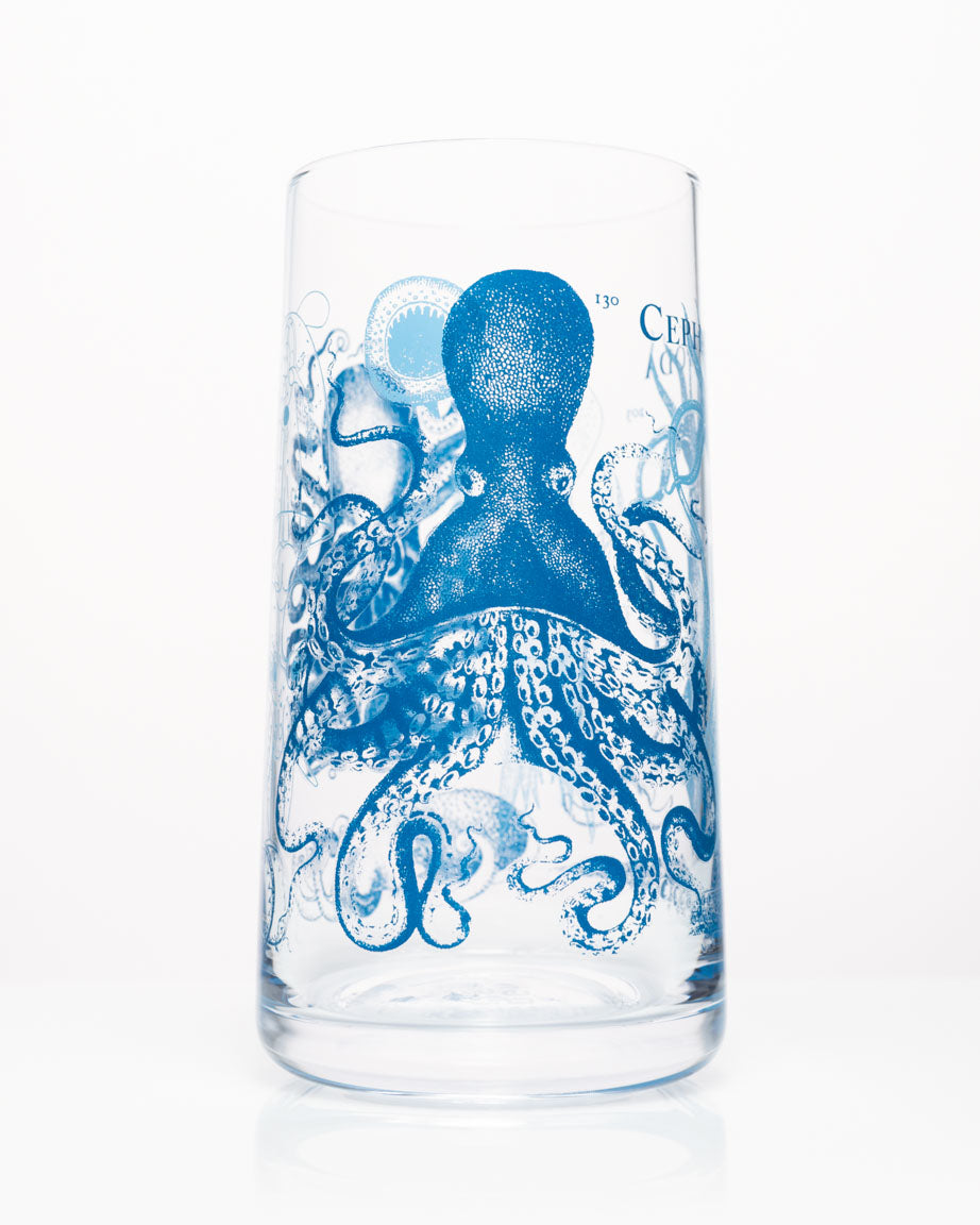 A Monsters of the Deep: Cephalopods Drinking Glass by Cognitive Surplus with a blue octopus on it.