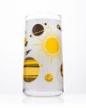 A Retro Space Drinking Glass with a yellow and black design on it from Cognitive Surplus.