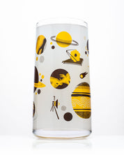 A Retro Space Drinking Glass with a design on it from Cognitive Surplus.