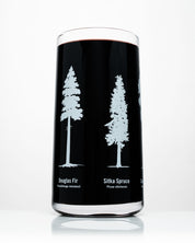 A Classic Science Drinking Glassware Set of 12 by Cognitive Surplus with three trees on it.