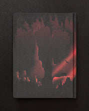 A Into the Earth: Caves Dark Matter Notebook by Cognitive Surplus with an image of a cave and a red light.