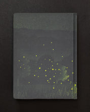 A Firefly Meadow Dark Matter Notebook with fireflies on a black background by Cognitive Surplus.