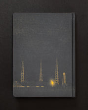 A Ready to Launch Dark Matter Notebook with an image of a radio tower, made by Cognitive Surplus.