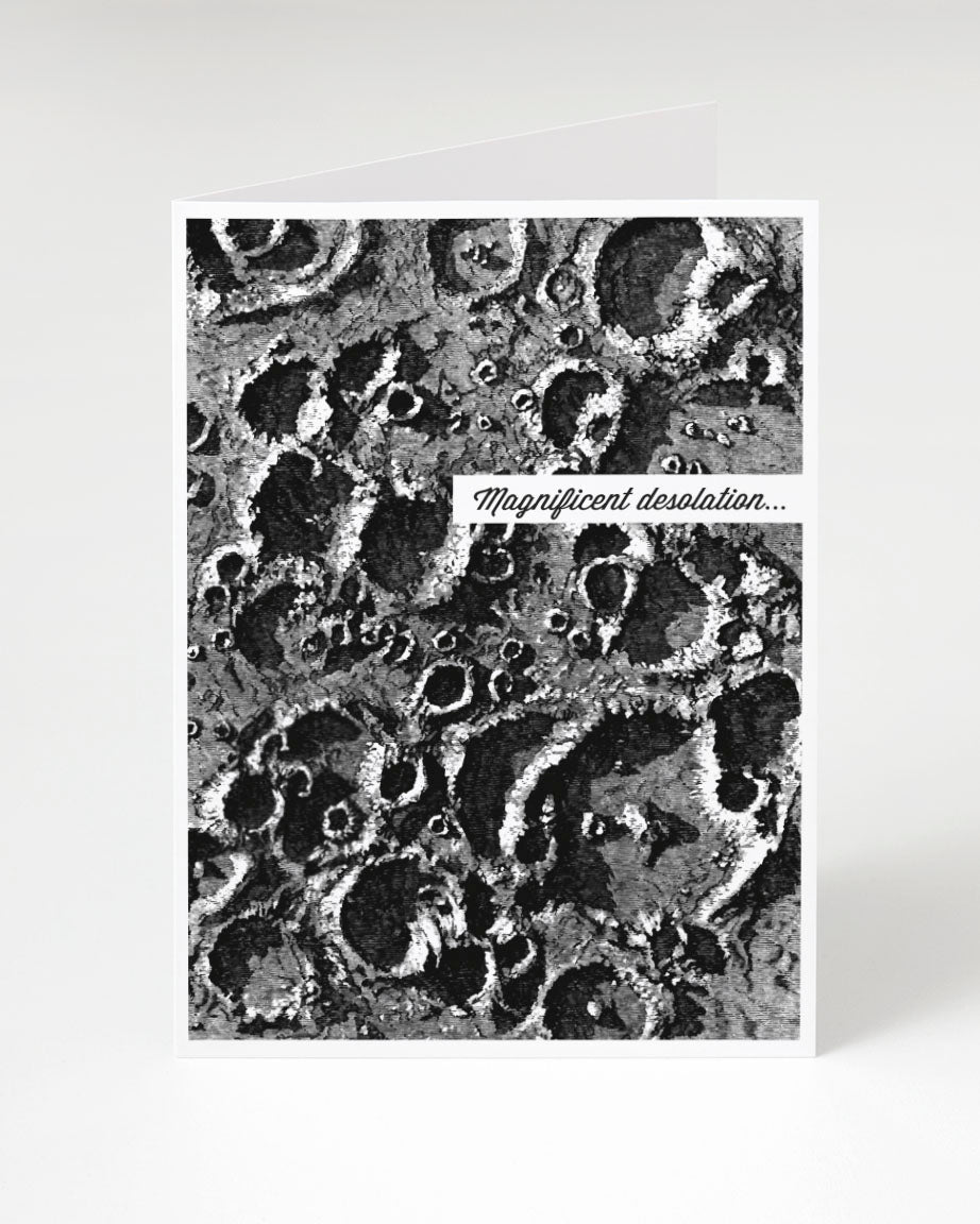 A Magnificent Desolation Greeting Card by Cognitive Surplus, with an image of a crater.