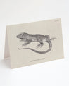 A Cognitive Surplus Iguana Greeting Card with an illustration of a lizard.