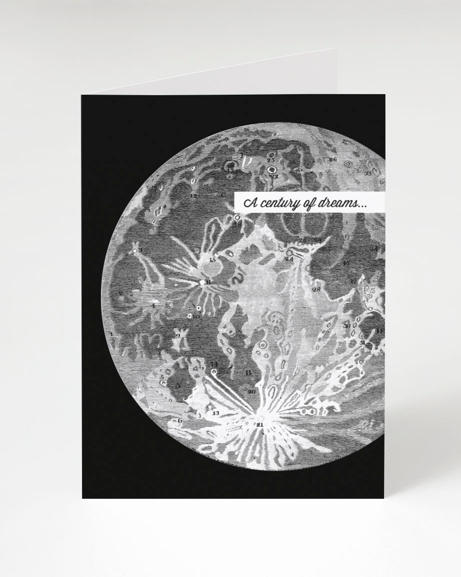 A black and white Moon: A Century of Dreams greeting card with an image of a moon by Cognitive Surplus.