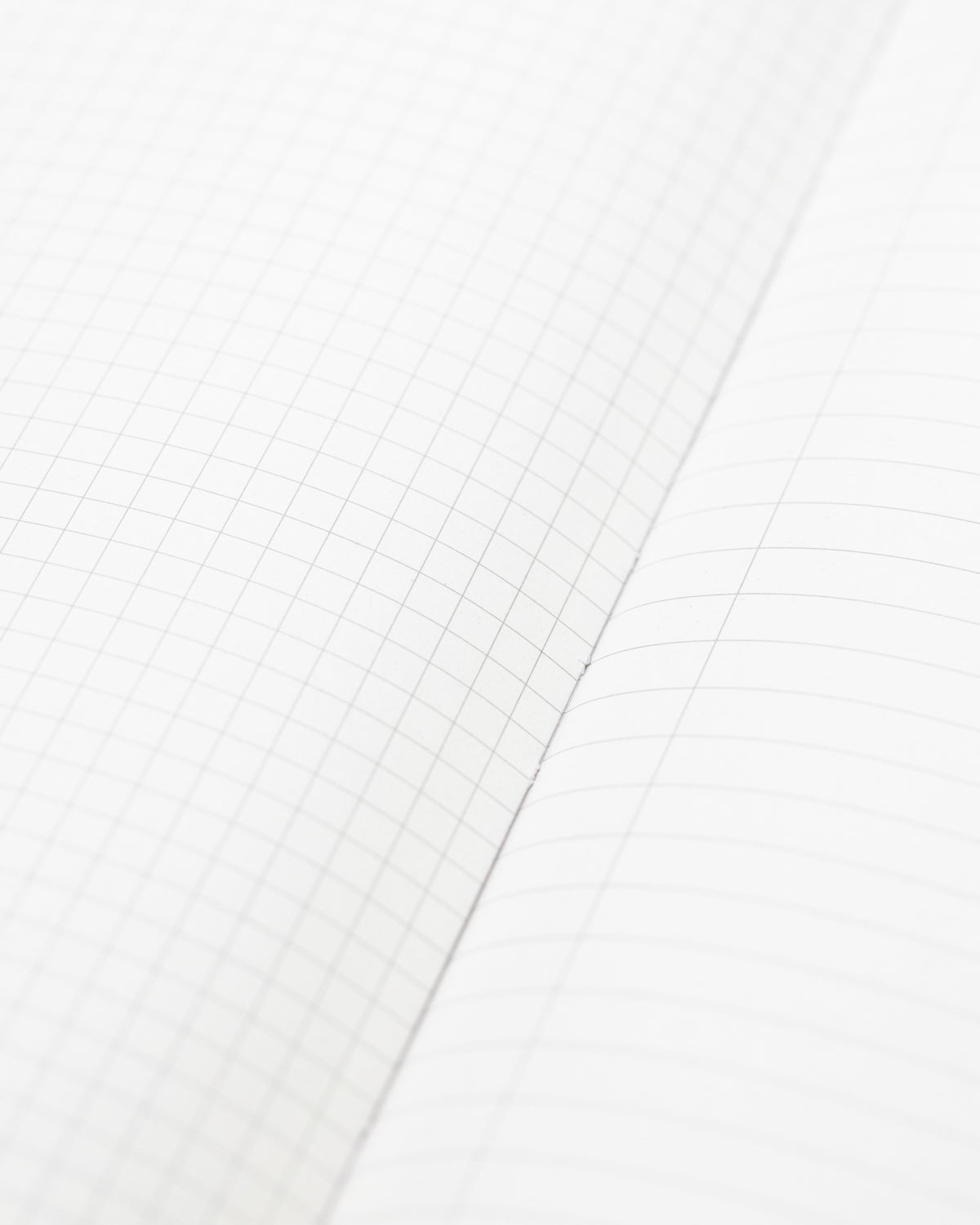A white Hypothesis Mystery Notebook 6-pack with a grid on it from Cognitive Surplus.