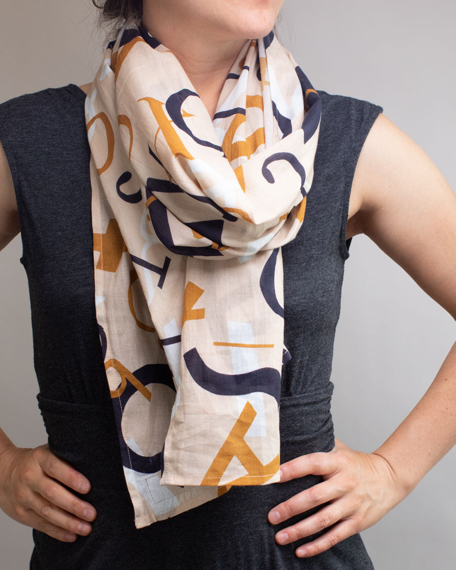 A woman wearing a Mathematical Musings Scarf by Cognitive Surplus.