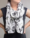 A woman wearing a "Cell Biology: Meiosis Scarf" by Cognitive Surplus.