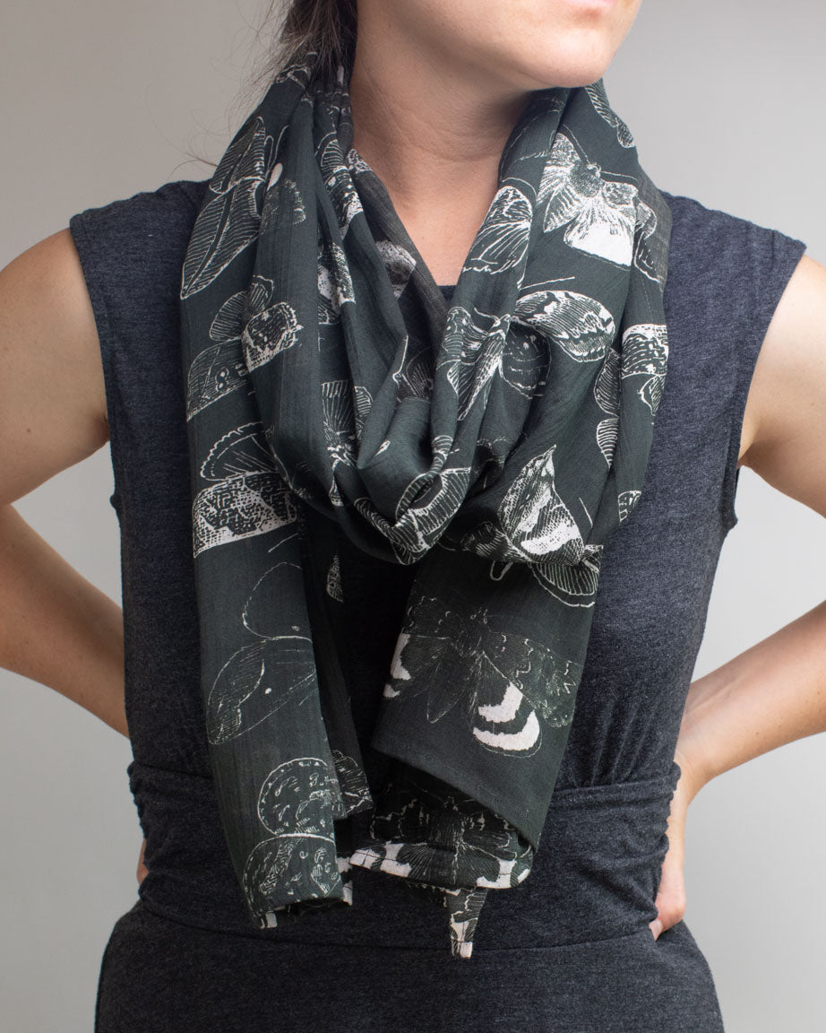 A woman wearing a Moth Scarf by Cognitive Surplus.