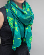 A woman wearing a Retro Insects Scarf by Cognitive Surplus.
