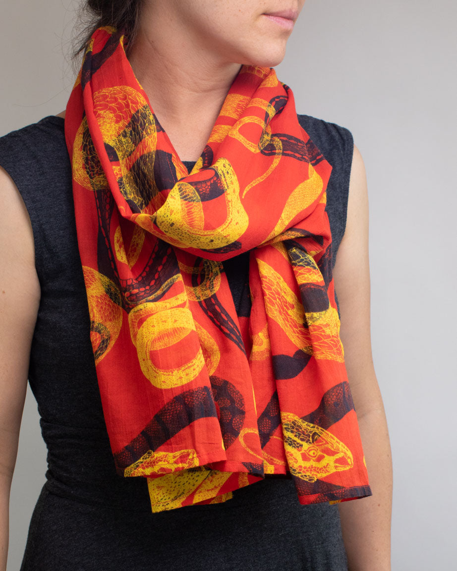 A woman wearing a Snake Scarf from Cognitive Surplus.