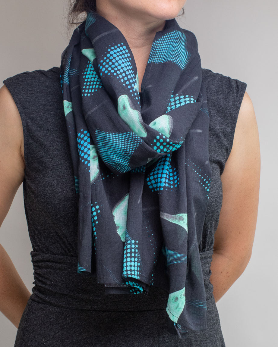 A woman wearing a Microbiology: Stentor Scarf by Cognitive Surplus.