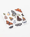 A piece of paper with a variety of Cognitive Surplus Butterfly Party Stickers on it.