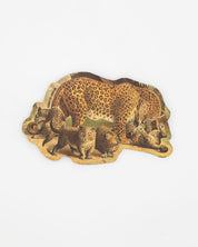 A piece of wood with a Leopard Sticker by Cognitive Surplus on it.