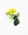A Prickly Pear sticker with a yellow flower on it by Cognitive Surplus.