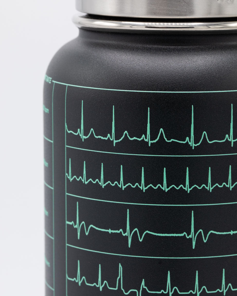 A Heartbeat 32 oz Steel Bottle with the brand Cognitive Surplus on it.