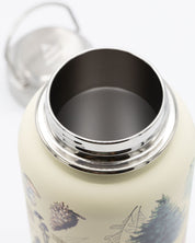 A Woodland Forest 32 oz Steel Bottle with a lid and pine trees on it.