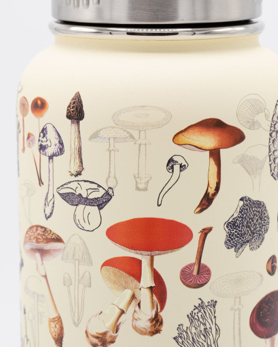 A jar with Cognitive Surplus Mushrooms 32 oz Steel Bottle on it.