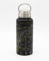 A Cognitive Surplus black and gold Star Chart 32 oz Steel Bottle with a star map on it.