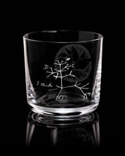 A SECONDS: Tree of Life Whiskey Glass by Cognitive Surplus with a drawing of a tree on it.