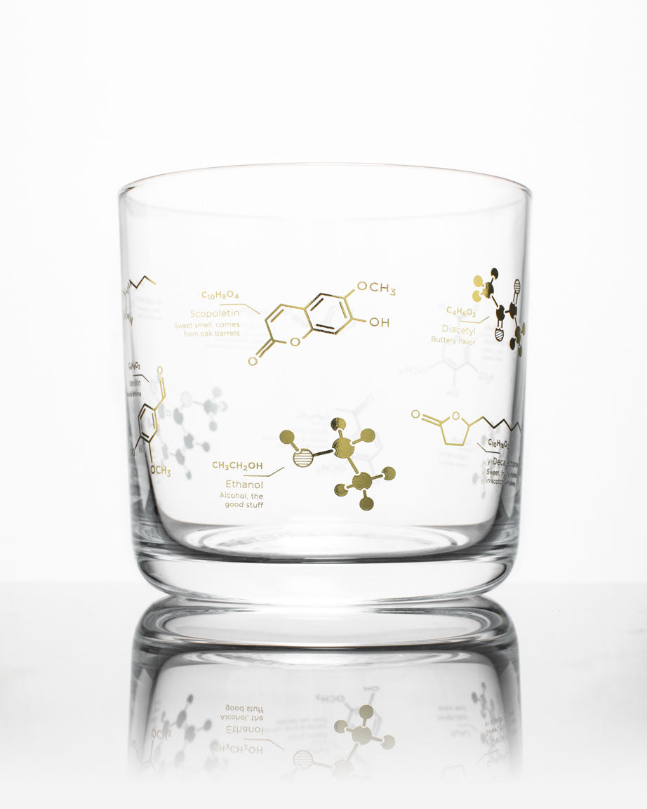 A Chemistry of Whiskey Glass with a gold molecule design on it by Cognitive Surplus.