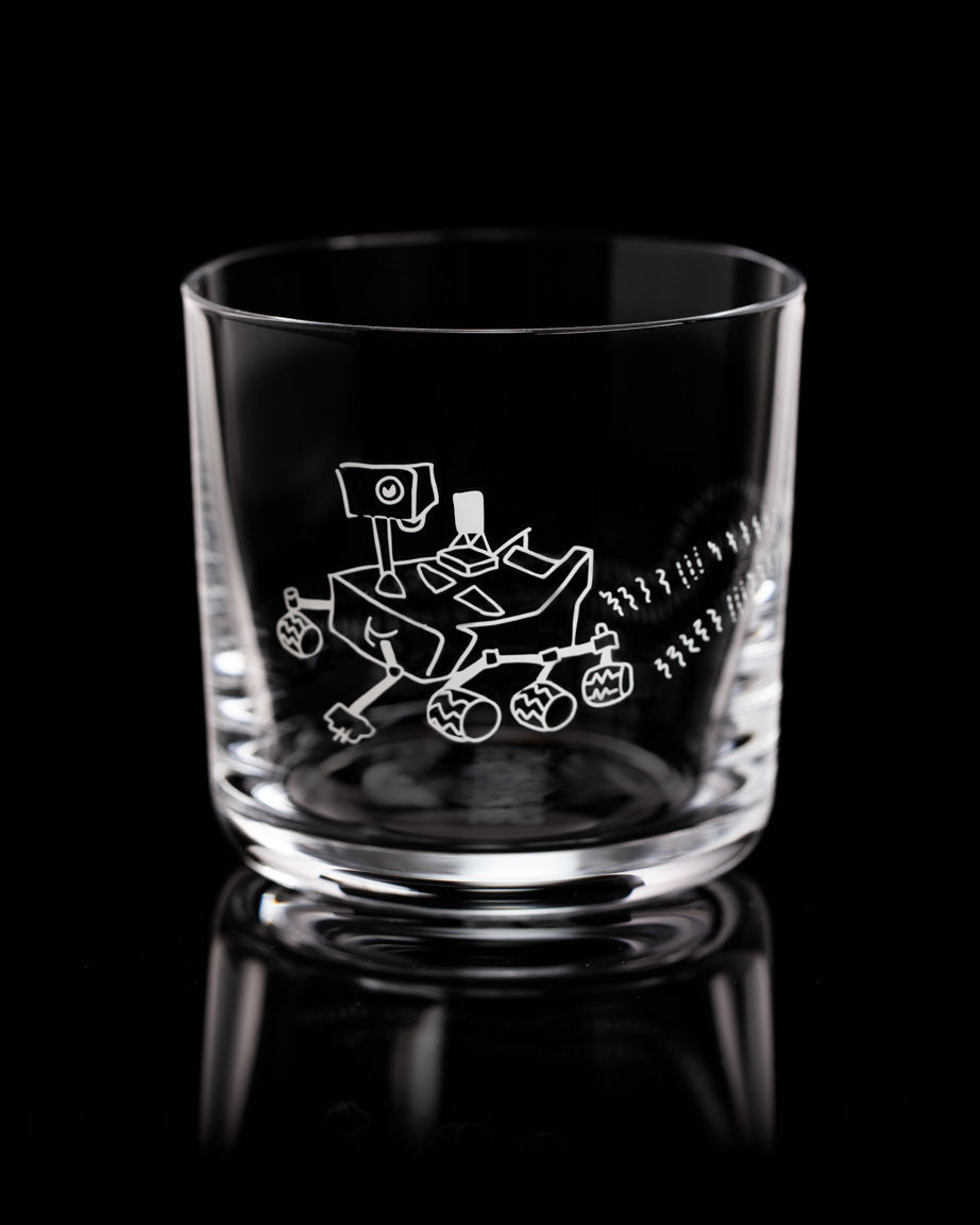 A SECONDS: Mars Rover Perseverance Whiskey Glass with an image of a spacecraft on it from Cognitive Surplus.