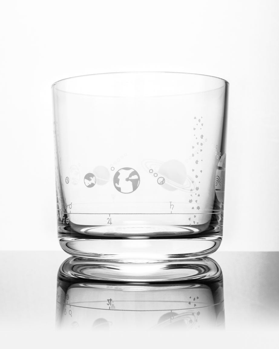 A Solar System Whiskey Glass with a design on it by Cognitive Surplus.