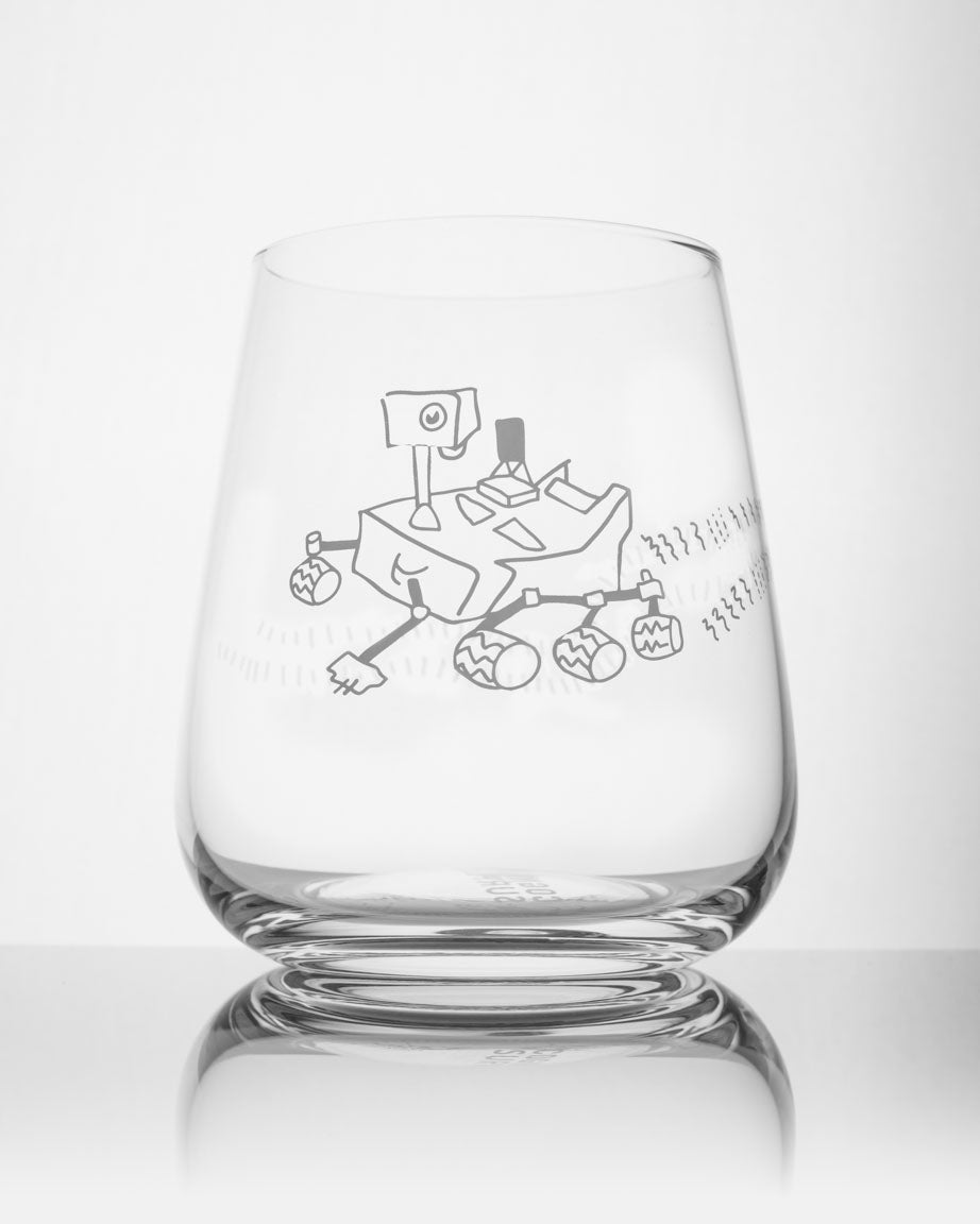 A Mars Rover Perseverence Wine Glass with a drawing of a train on it, made by Cognitive Surplus.